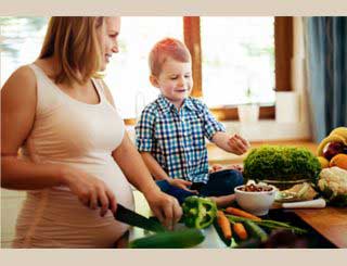 Pregnant women Chopping Veggies